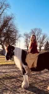 Rachel riding Winston on a clear day